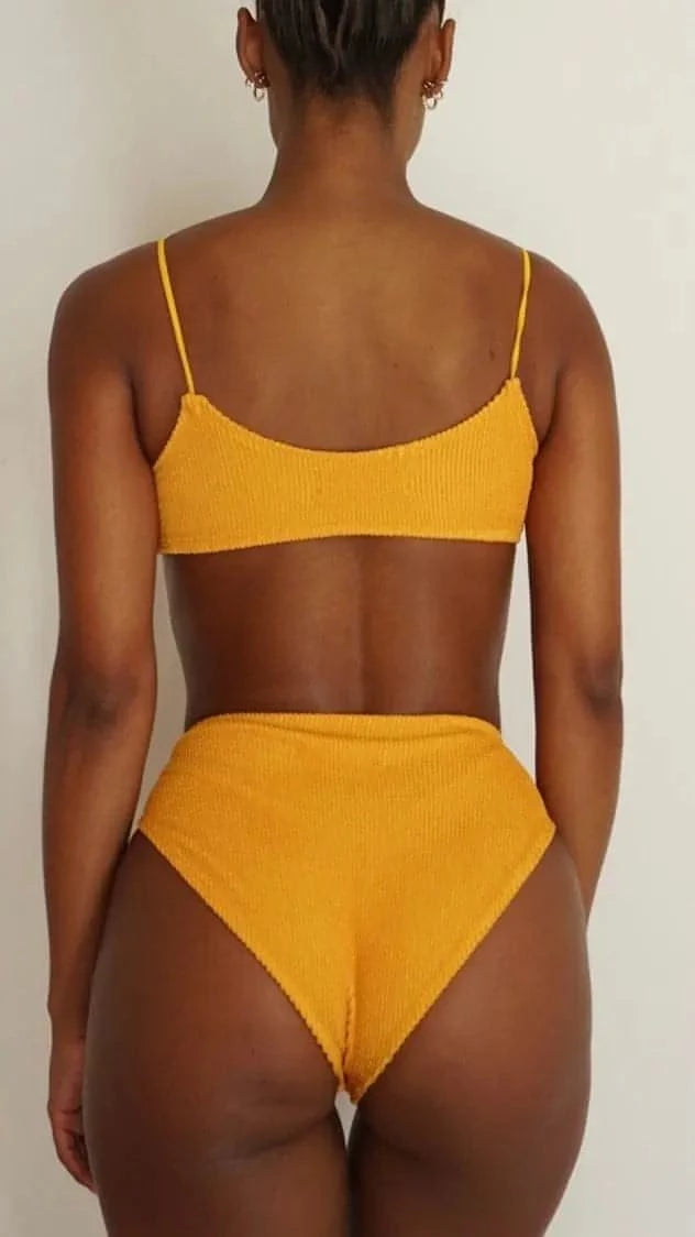 Gsaints model wearing tankini top in yellow