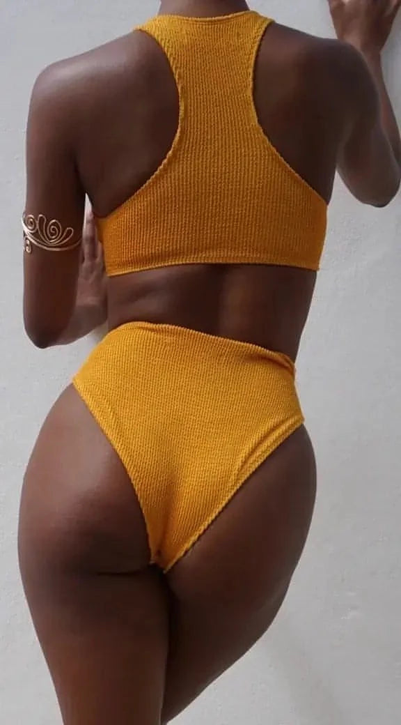 GSaints Model showcasing backside of tumeric high rise bathing suit