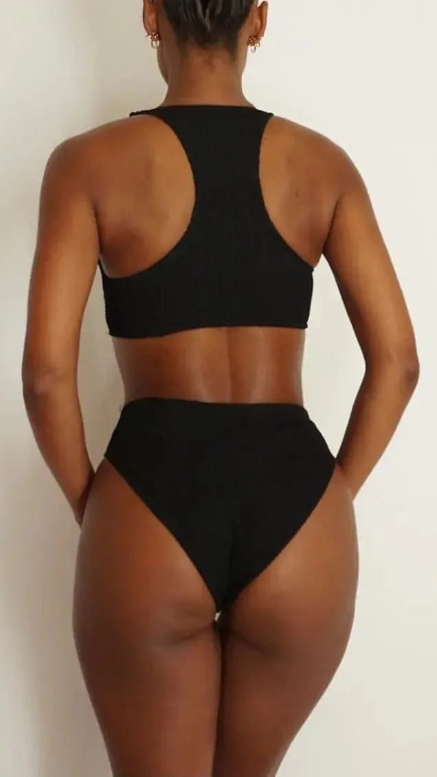 GSaints Model showcasing backside of black high rise bathing suit