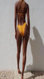GSaints Model Backside Wearing Turmeric color bikini 